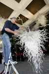 Robert Kaindl installing chandeliers at Four Seasons Beverly Hills Hotel